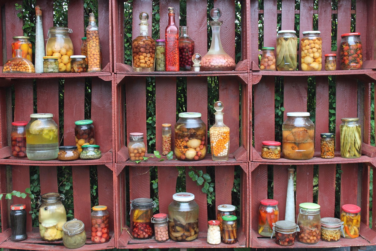 Wooden drawer filled with labeled spice jars for kitchen storage