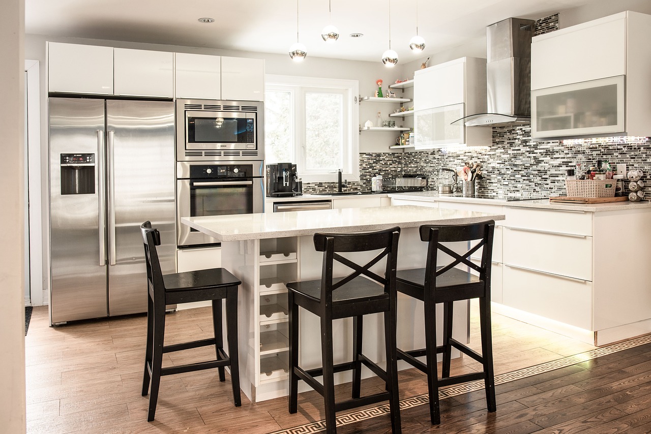Close-up of a modern kitchen with flat panel slab cabinet doors and a single uninterrupted surface