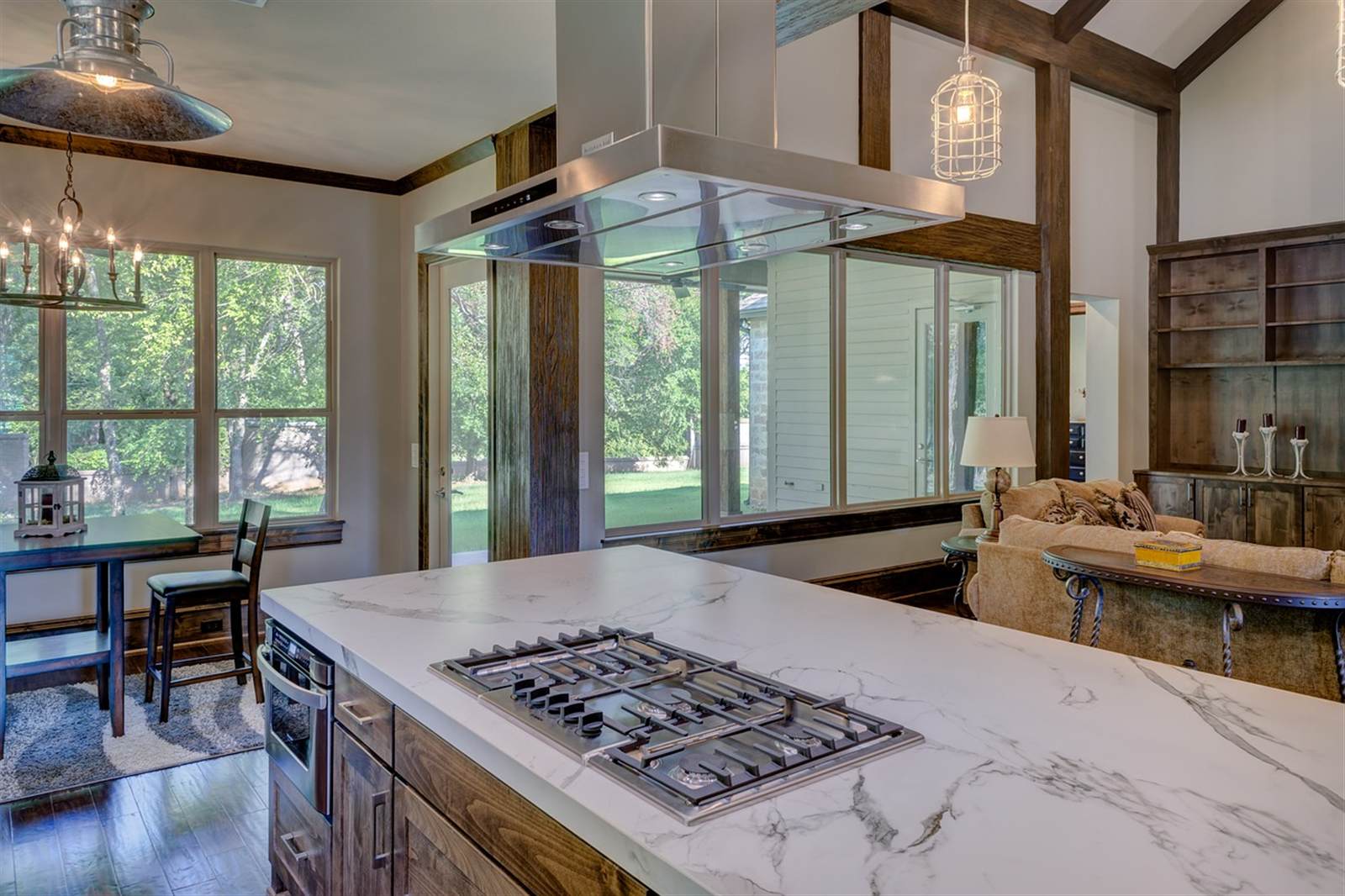 Kitchen island with integrated stovetop illustrating clean sightlines between cooking and gathering zones
