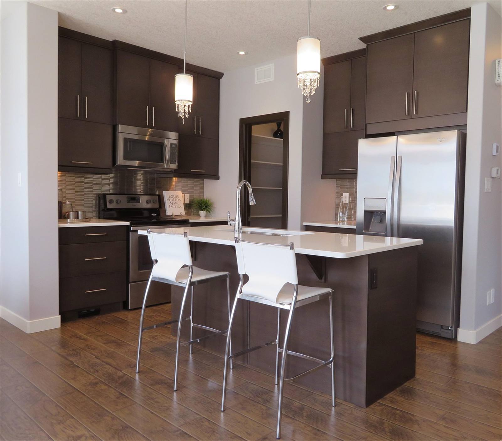Kitchen counter positioned near the refrigerator, illustrating the sink-stove-fridge relationship